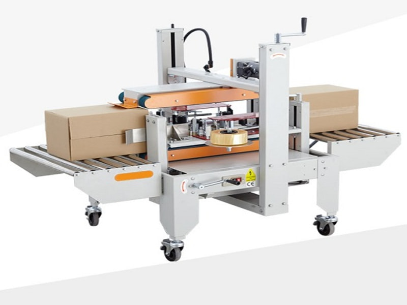 Máy dán băng keo thùng carton – Giải pháp đóng gói hiệu quả 9 Máy dán băng keo thùng carton
